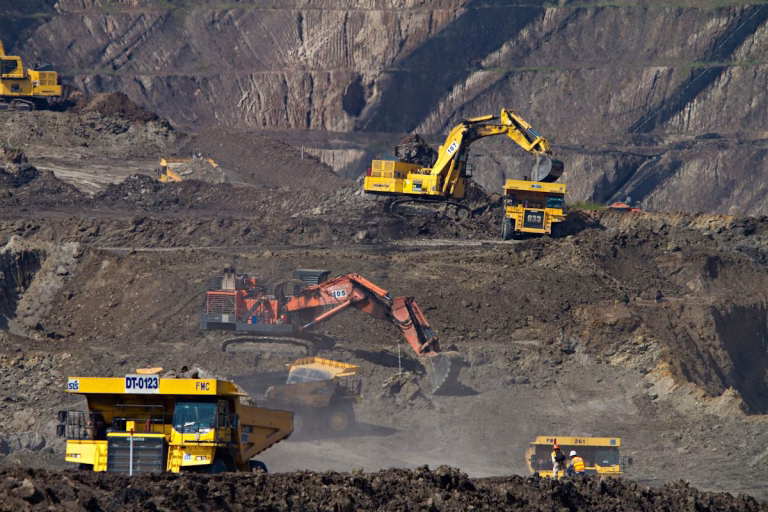 Excavators at a mining site - mining reagent supply chain Australia